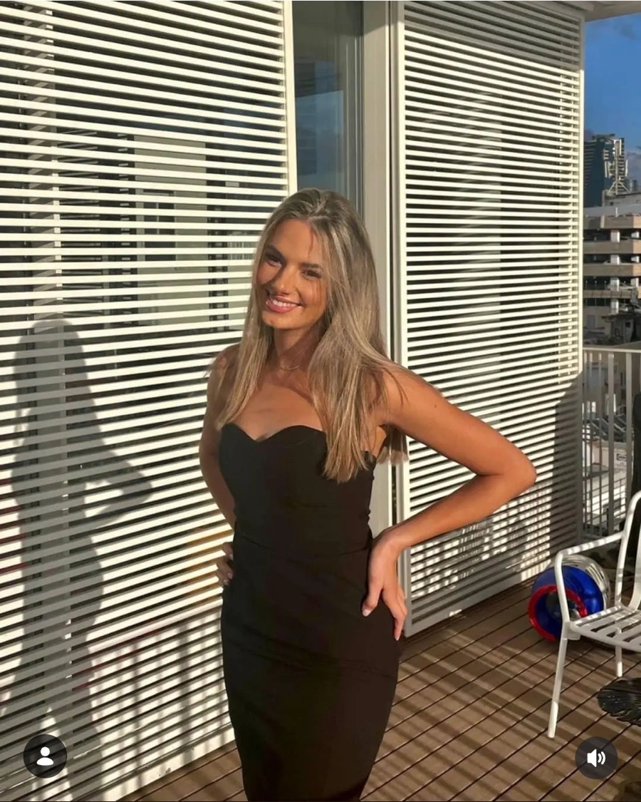Black dress on a sunlit balcony
